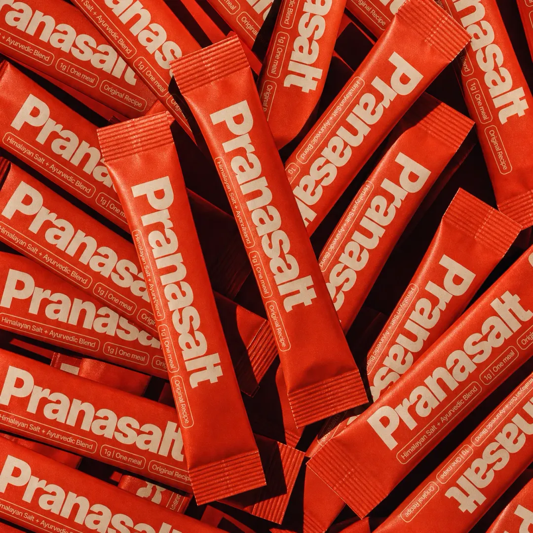 A spread of red Pranasalt stick-pack sachets
